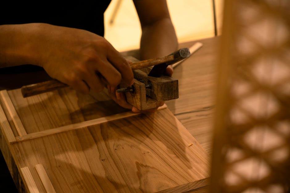 Artisan hands working with precision tools representing dedicated support